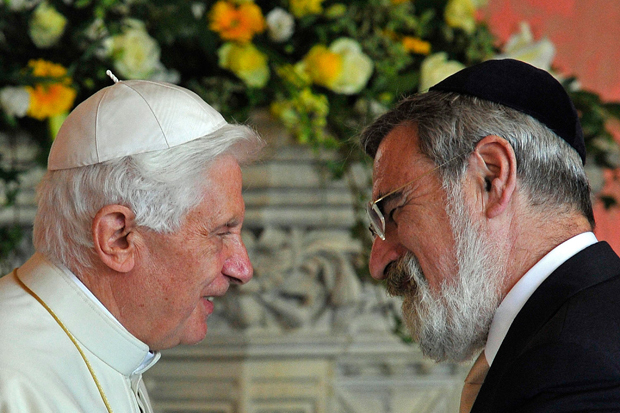 Pope Benedict XVI (L), meets Britain's Chief Rabbi Jonathan Sacks, during a meeting of religious leaders at St Mary's University College, in Twickenham, south-west London on September 17, 2010. British police arrested five men Friday on suspicion of plotting a "terrorist" attack linked to the historic state visit of Pope Benedict XVI. The Vatican insisted that the pope was "calm" following the arrests and that it had full confidence in Scotland Yard's ability to protect him. 
